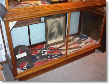 Confederate & U.S. flags, saddle, sword, etc
